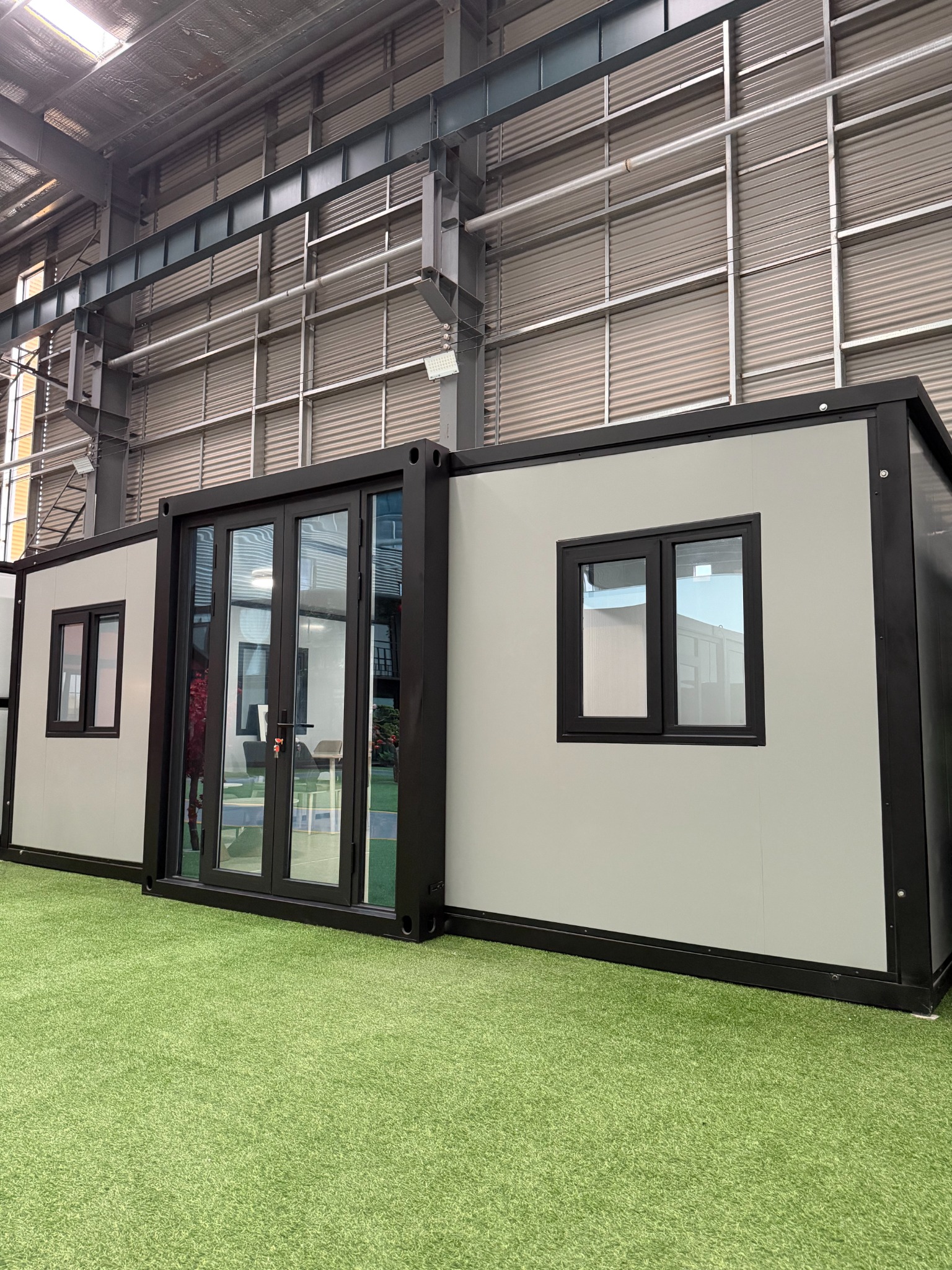 Real expandable container house exterior in showroom