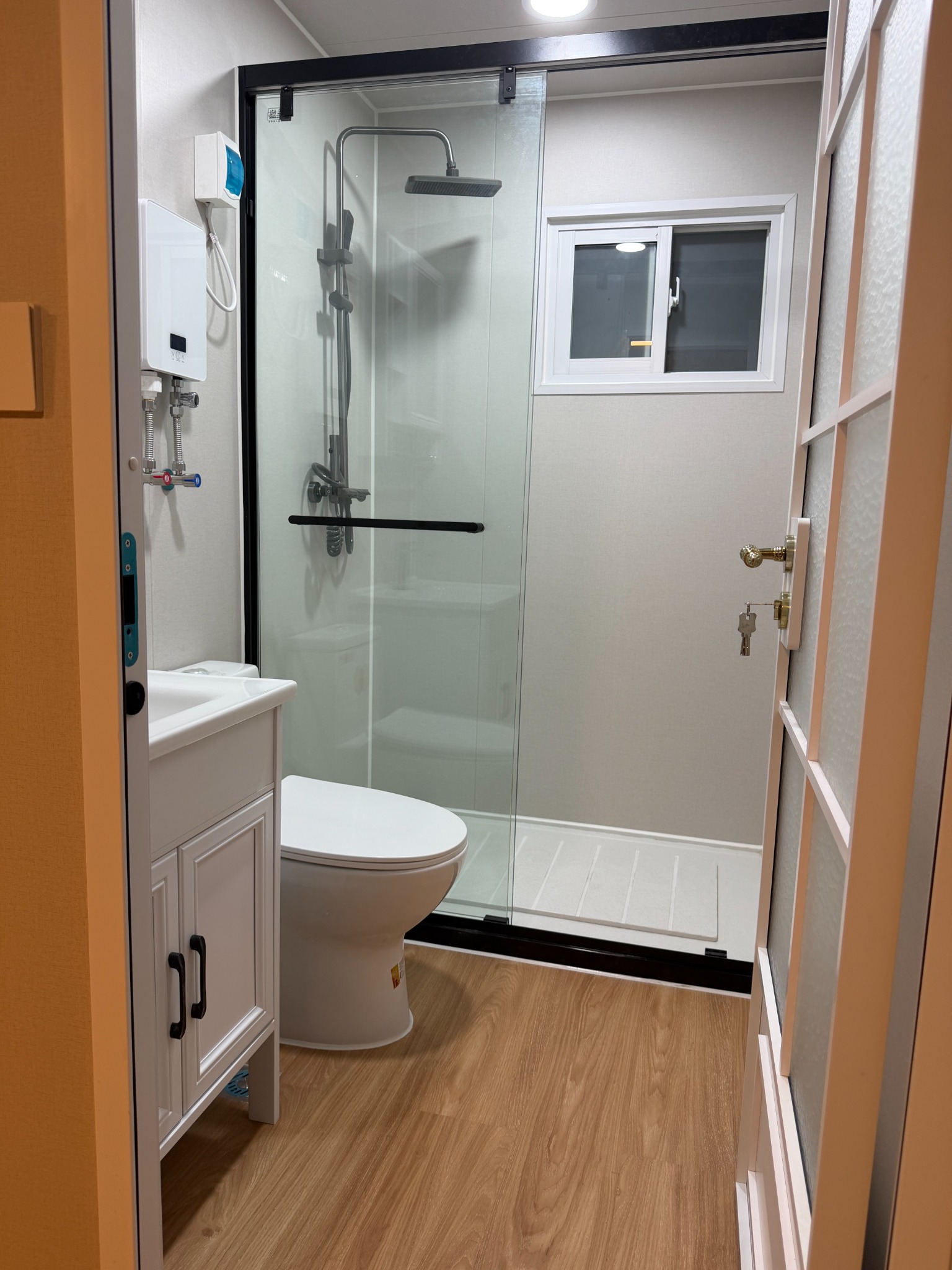 Completed expandable container house bathroom and shower