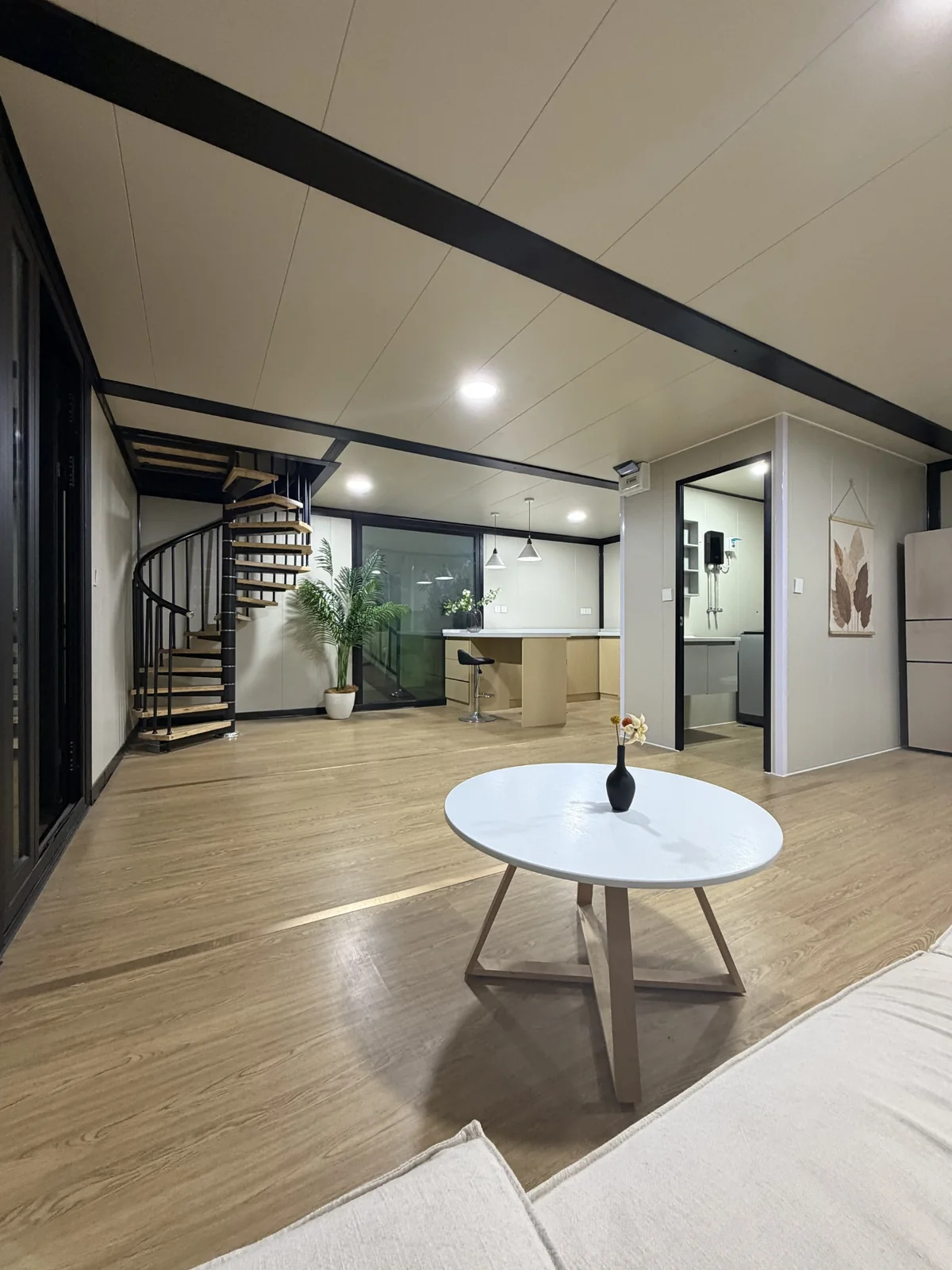 Open living and kitchen interior in the custom double-storey expandable house