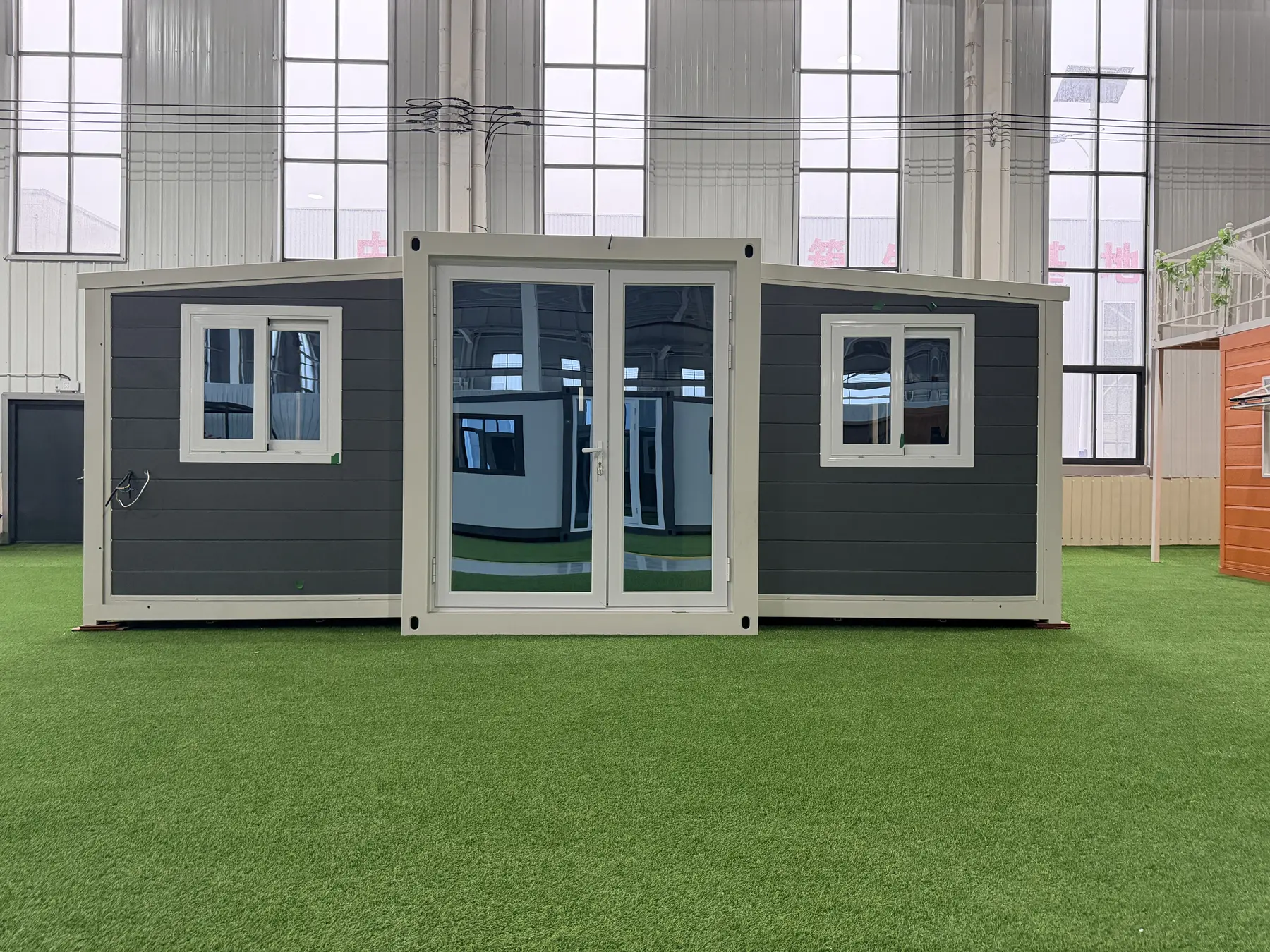 Front view of a charcoal 20ft expandable container house