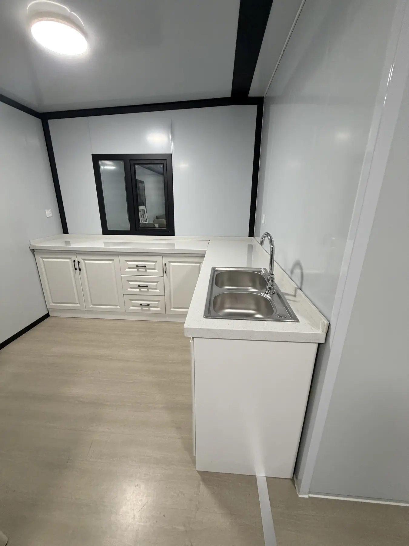 Kitchen services and cabinet layout in a 20ft expandable container house