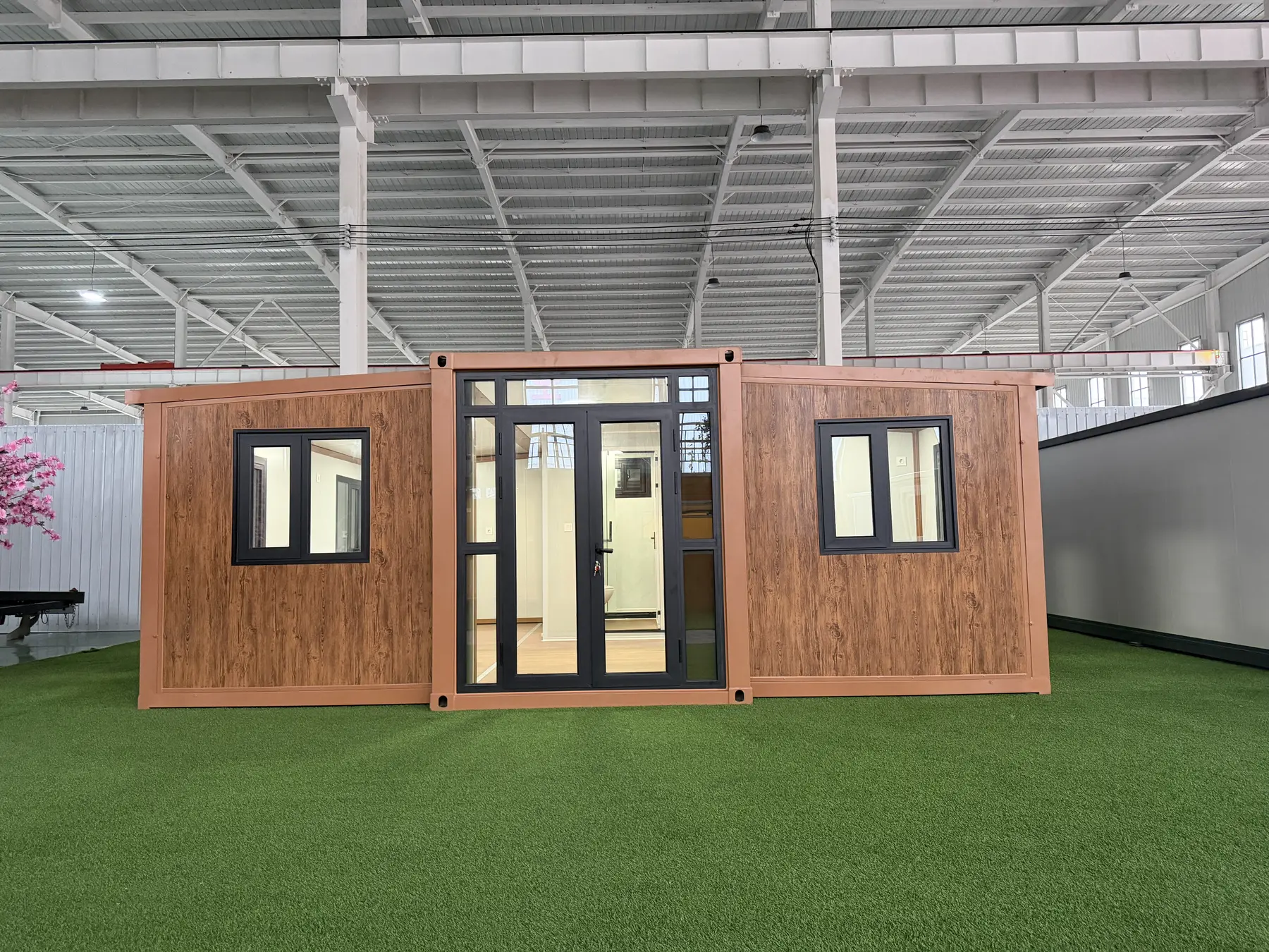 Front view of a wood-look 20ft expandable house
